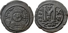 Byzantine Coins JUSTINIAN I (527-565). Follis. Constantinople. Dated RY 16 (542/3). Obv: D N IVSTINIANVS P P AVG. Helmeted and cuirassed bust facing, holding globus cruciger and shield decorated with 