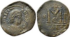 Byzantine Coins JUSTINIAN I (527-565). Follis. Carthage. Obv: DN IVSTINIANVS P P AG. Diademed, draped and cuirassed bust right. Rev: Large M; star to left, crosses above and to right. KART in exergue.