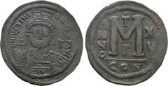 Byzantine Coins JUSTINIAN I (527-565). Follis. Constantinople. Dated RY 15 (541/2). Obv: D N IVSTINIANVS P P AVG. Helmeted and cuirassed bust facing, holding globus cruciger and shield decorated with 