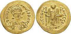Byzantine Coins JUSTINIAN I (527-565). GOLD Solidus. Constantinople. Obv: D N IVSTINIANVS P P AVG. Helmeted and cuirassed bust facing slightly right, holding spear and shield decorated with horseman m