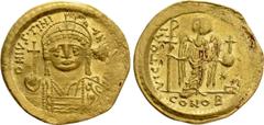 Byzantine Coins JUSTINIAN I (527-565). GOLD Solidus. Constantinople. Obv: D N IVSTINIANVS P P AVG. Helmeted, draped and cuirassed bust facing, holding globus cruciger and shield with horseman motif. R