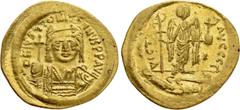 Byzantine Coins JUSTINIAN I (527-565). GOLD Solidus. Constantinople. Obv: D N IVSTINIANVS P P AVG. Helmeted, draped and cuirassed bust facing, holding globus cruciger and shield with horseman motif. R