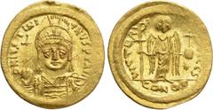 Byzantine Coins JUSTINIAN I (527-565). GOLD Solidus. Constantinople. Obv: D N IVSTINIANVS P P AVG. Helmeted and cuirassed bust facing, holding globus cruciger and shield decorated with horseman motif.