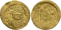 Byzantine Coins JUSTINIAN I (527-565). GOLD Solidus. Constantinople. Obv: D N IVSTINIANVS P P AVG. Helmeted and cuirassed bust facing, holding globus cruciger and shield decorated with horseman motif.