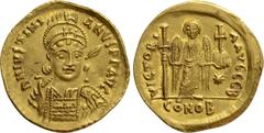 Byzantine Coins JUSTINIAN I (527-565). GOLD Solidus. Constantinople. Obv: D N IVSTINIANVS P P AVG. Helmeted and cuirassed bust facing slightly right, holding spear and shield decorated with horseman m