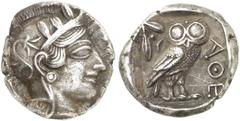 GRIECHEN ATTIKA ATHEN Tetradrachme (16,90g). 4. Jh. v. Chr. Vs.: Kopf der Athena mit attischem Helm n. r. Rs.: AΘE, Eule, Olivenzweig und Mondsichel. Svoronos Taf. 19. Dunkle Tönung, Rs. Graffito, fas