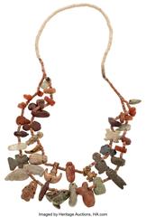 Miscellaneous Treasure of Forrest Fenn. Tairona Necklace with Gold and Stone Pendants Colombia, circa 500 - 1000 AD An attractive assemblage of a variety of ancient gold and stone pendants with small 