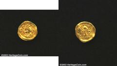 Ancients, Byzantine. Justin I, A.D. 518-527. AV tremissis minted at Constantinople. Diademed, cuirassed and draped bust right of Justin I/Victory advancing right, head left, holding wreath and globus 