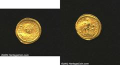 Justin II, A.D. 565-578. AV solidus minted at Constantinople. Helmeted and cuirassed beardless bust facing, holding globe surmounted by Victory and shield/Constantinopolis seated facing, head right, h