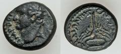 JUDEA CAPTA. Local issues. Domitian (AD 81-96). Æ 14mm (3.62 gm). Caesarea maritima, AD 83. Laureate head of Domitian left / Winged Caduceus. Hendin 1457 (this coin illustrated). Dark green patina. Ve