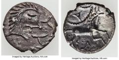 Ancients Celtic BRITAIN. Iceni. Queen Boudicca (AD 61). AR unit (13mm, 1.07 gm, 7h). Choice XF. Uninscribed coinage. Celticized head right, slit for eye; three pellets below, two trefoils to right / C