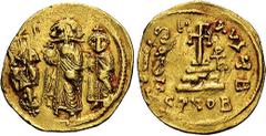 Heraclius, with Heraclius Constantine and Heraclonas. A.D. 610-641. AV solidus (21 mm, 4.42 g). Constantinople, ca. A.D. 632-635. Heraclius standing facing, holding globus cruciger, flanked by his son
