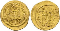 BYZANTINE COINS BYZANTINE EMPIRE. MAURICIUS TIBERIUS, 582-602. Solidus AD 583/4-602, Constantinople. AV. 4,39 g. D N MAVRC Tib PP AVG Draped and cuirassed bust facing, wearing plumed helmet and holdin
