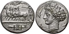 THE OSAKA COLLECTION OF CLASSICAL COINS SICILY. SYRACUSE. Dekadrachm, signed by the master engraver Kimon, 410-400 BC. AR 42.78 g. Fast quadriga l., the charioteer, wearing sleeveless chiton, holds th
