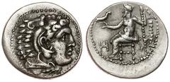 Macedonia. Alejandro III Magno. Dracma. 336-323 a.C. Acroathon. Anv.: Cabeza recubierta con piel de león. Rev.: Zeus entronado a izquierda con águila y cetro, delante monograma. Ar. 4,09g. MU-171. MBC