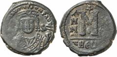 BYZANTINE COINS. Maurice Tiberius (AD 582-602). AE Follis, Theopolis (Antioch) mint. Obv: Crowned bust facing, wearing consular robes, holding mappa and eagle-tipped scepter. Rev: Large M; cross above