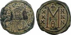 Théophile, follis type 2, Constantinople, 9e officine, c.829-831 A/* ThEO - FIL BASILV Théophile barbu de face, à mi-corps, portant le stemma, vêtu de la chlamyde et tenant la croix patriarcale et l'a