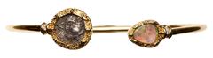 Ancient Coins Lovely Ancient Greek Ionia Silver Coin, Ca. 480-400 BC mounted in 18K Gold Bangle Bracelet with Opal and Diamonds. This stunning 18K yellow gold bangle bracelet is very unique with speci