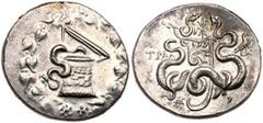 Lydia, Tralles. Silver Cistophoric Tetradrachm (12.43 g), ca. 166-67 BC. 140-135 BC. Serpent emerging from within cista mystica with open lid; all within ivy wreath. Reverse: TPAΛ to left, bow case be