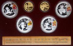 China. Gold and Silver Set for the Beijing Olympic Games, 2008. Gold 150 Yuan (2 pieces). 1/3 Ounce each .999 fine gold. Silver 10 Yuan (4 pieces) 1 ounce each. Gold features an ancient Chinese archer