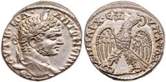 Ancient Coins Caracalla. Silver Tetradrachm (12.05 g), AD 198-217. Antioch in Syria, Cos. IV (AD 214/5). Laureate head of Caracalla right. Reverse: Eagle standing facing on thigh and leg of animal, he