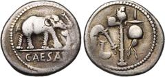 ROMAN REPUBLIC Jules César (†44), AR denier, 49-48 av. J.-C., Gaule. D/ CAESAR Eléphant à d. piétinant un dragon. R/ Emblèmes sacerdotaux: culullus, aspergillum, hache et apex. Cr. 443/1; Syd. 1006. 3