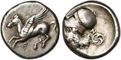 Monde grec - Greek World CORINTHE, AR statère, 386-307 av. J.-C. D/ Pégase en vol à g. Dessous, . R/ T. casquée d''Athéna à g. Derrière, N et triskèle de croissants dans un cercle. Ravel 1065a; Pegas
