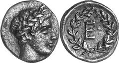 Epidauros The coinage of Epidauros of the late 4th or early Estimate: CHF 750.00 Obol (Silver, 0.93 g 2), late 4th or early 3rd century. Laureate head of Apollo to right. Rev. within laurel wreath tie