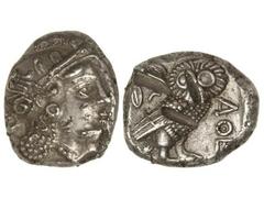 Tetradracma. 393-300 a.C. ATENAS. Anv.: Cabeza de Atenea con casco a derecha. Rev.: Lechuza en pie a derecha, delante A¶E, detrás rama de olivo y creciente. 16,41 grs. AR. (Cortes de cizalla en revers