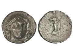 Tetradracma. 351-344 a.C. HIDRIEUS. Anv.: Cabeza laureada de Apolo de frente, mirando a derecha. Rev.: Zeus Labraundos en pie a derecha, delante leyenda. 14,60 grs. (Oxidaciones y golpecitos en revers