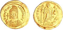 BYZANTINE COINS Justinien 1er - Solidus (527-563, Constantinople) A/ D N IVSTINIANVS PP AVG. Buste de face casqué tenant un globe surmonté d'une croix. R/ VICTORI AVGGG. (Thetra). Ange de face tenant 