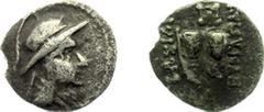 The East - The Baktrian Kingdom - Eukratides (171-135 BC) - AR Obol (0.57 gm.) - Helmeted bust right / Caps of the Dioskouroi and two palm-branches with Greek legend (S. 7578) - VF