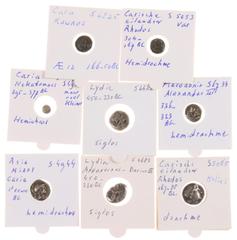 Ancient coins in lots Ancient coins in lots - A lot with 8 ancient coins: a Hemidrachm of Alexander III, a Hemidrachm and a Drachm of Rhodos, a Hemiobol and a Hemidrachm and an AE12 of Caria and 2 x A