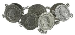 Ancient coins in lots - Roman coinage Roman coinage - A bracelet, made of 7 Roman Antoniniani (4 x Philippus I Arabs, including with rev. elephant and 3 x Gordianus Pius III), the coins soldered toget