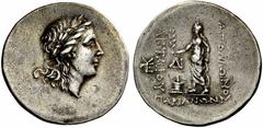 Coins of the Greeks Mysia Parion. Circa 165-143 BC. Tetradrachm (Silver, 16.95 g 12). Laureate head of Apollo to right. Rev. AΠOΛΩNOΣ AKTAIOΥ / ΠAΡIANΩN Apollo, laureate and draped to the waist, holdi