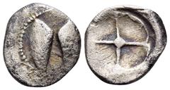 The Collection sans Pareille of Ancient Greek Fractions, Part III SICILY. Kamarina. Circa 480-450 BC. Litra (Silver, 10 mm, 0.55 g). Two greaves(?); border of dots. Rev. Wheel with four spokes. G. Man