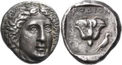 Greek Coins ISLANDS OFF CARIA, Rhodos. Rhodes. Circa 408/7-404 BC. Tetradrachm (Silver, 15.07 g, 12 h). Head of Helios facing, turned slightly to the right. Rev. ΡΟΔΙΟΝ Rose; to right, eagle, with clo