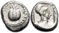 Greek PAMPHYLIA. Side. Circa 460-430 BC. Stater (Silver, 20.5 mm, 10.90 g, 7 h), overstruck on an uncertain stater of Aspendos, c. 440-430. Pomegranate surrounded by dotted guilloche border. Rev. Helm