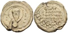 Byzantine Seals Basileios Hypatos, 11th century. Seal or Bulla (Lead, 31 mm, 24.90 g, 12 h), Overstruck on a seal of a certain Nikolaos. O B/A-C/H/Λ Facing, nimbate and draped bust of St. Basil, holdi
