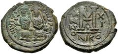 Byzantine Justin II, with Sophia, 565-578. Follis (Bronze, 30 mm, 12.80 g, 7 h), Nicomedia, 1st officina (A), year 11 = 575-576. Justin and Sophia seated facing on double throne, holding globus crucig