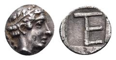 Greek IONIA. Kolophon. Circa 450-410 BC. Tetartemorion (Silver, 7 mm, 0.36 g, 9 h). Laureate head of Apollo to right; behind head, vine with leaves. Rev. Monogram of TE (= tetartemorion) within incuse
