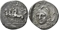 Greek Coins Syracuse Tetradrachm signed by Eukleidas circa 413-399, AR 27 mm, 16.56 g. Fast quadriga driven l. by female charioteer, holding reins in l. hand and raising flaming torch in r.; above, Ni