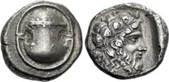 Greek Coins Boeotia, Thebes. Stater circa 425-395, AR 22 mm, 12.18 g. Boeotian shield, decorated with club. Rev. [Θ – Ε] Head of Dionysus r., bearded and wearing an ivy wreath; all within incuse squar