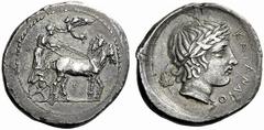 Greek Coins Catana Tetradrachm work of the “Maestro della Foglia”, circa 415-410, AR 16.35 g. Stationary quadriga r. driven by charioteer, wearing long chiton and holding reins with both hands; above,