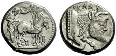 The M.L. Collection of Coins of Magna Graecia and Sicily Gela Tetradrachm circa 480-470, AR 17.15 g. Slow quadriga driven r. by charioteer holding kentron and reins; above, Nike flying r. to crown the
