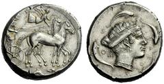 The M.L. Collection of Coins of Magna Graecia and Sicily Syracuse Tetradrachm circa 450-440, AR 17.36 g. Slow quadriga driven r. by bearded charioteer, wearing chiton and holding kentron and reins; ab