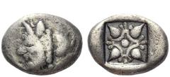 Greek Coins Cyrenaica, Cyrene Drachm circa 495-475, AR 4.05 g. Head of man-headed bull l.; behind, silphium fruit. Rev. Four lotus buds set in star pattern. BMC 19. Rosen 765. Very rare. Lightly toned