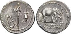 The Roman Republic Iulius Caesar. Denarius, mint moving with Caesar 49-48, AR 3.90 g. Pontifical emblems: culullus, aspergillum, axe and apex. Rev. Elephant r., trampling dragon; in exergue, CAESAR. B