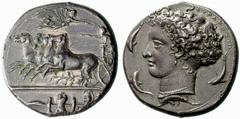 Greek Coins Syracuse No.: 96 Estimate: CHF 100000 d=37 mm Decadrachm signed by Kimon circa 404-400, AR 42.60 g. Fast quadriga driven l. by charioteer, holding reins and kentron; in field above, Nike f