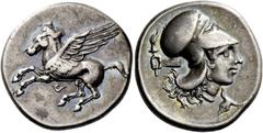 Greek coins Corinthia, Corinth. Stater circa 400-380, AR 8.47 g. Pegasus flying l.; below, [koppa]. Rev. Head of Athena r., wearing Corinthian helmet; in l. field, hand with torch and in r. field, buc